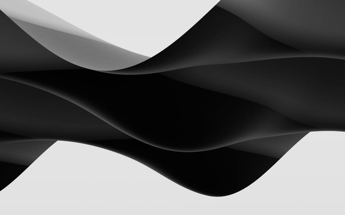 Sweeping curved forms against a pale sky